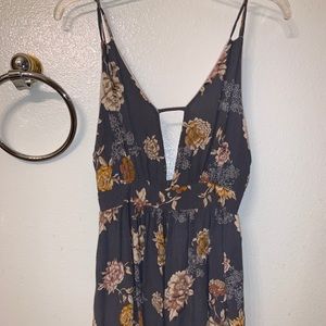 NWOT Cute and flattering deep V floral romper